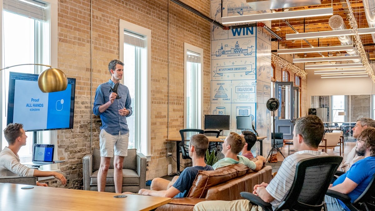 Sales and customer success team collaborating around a CRM dashboard